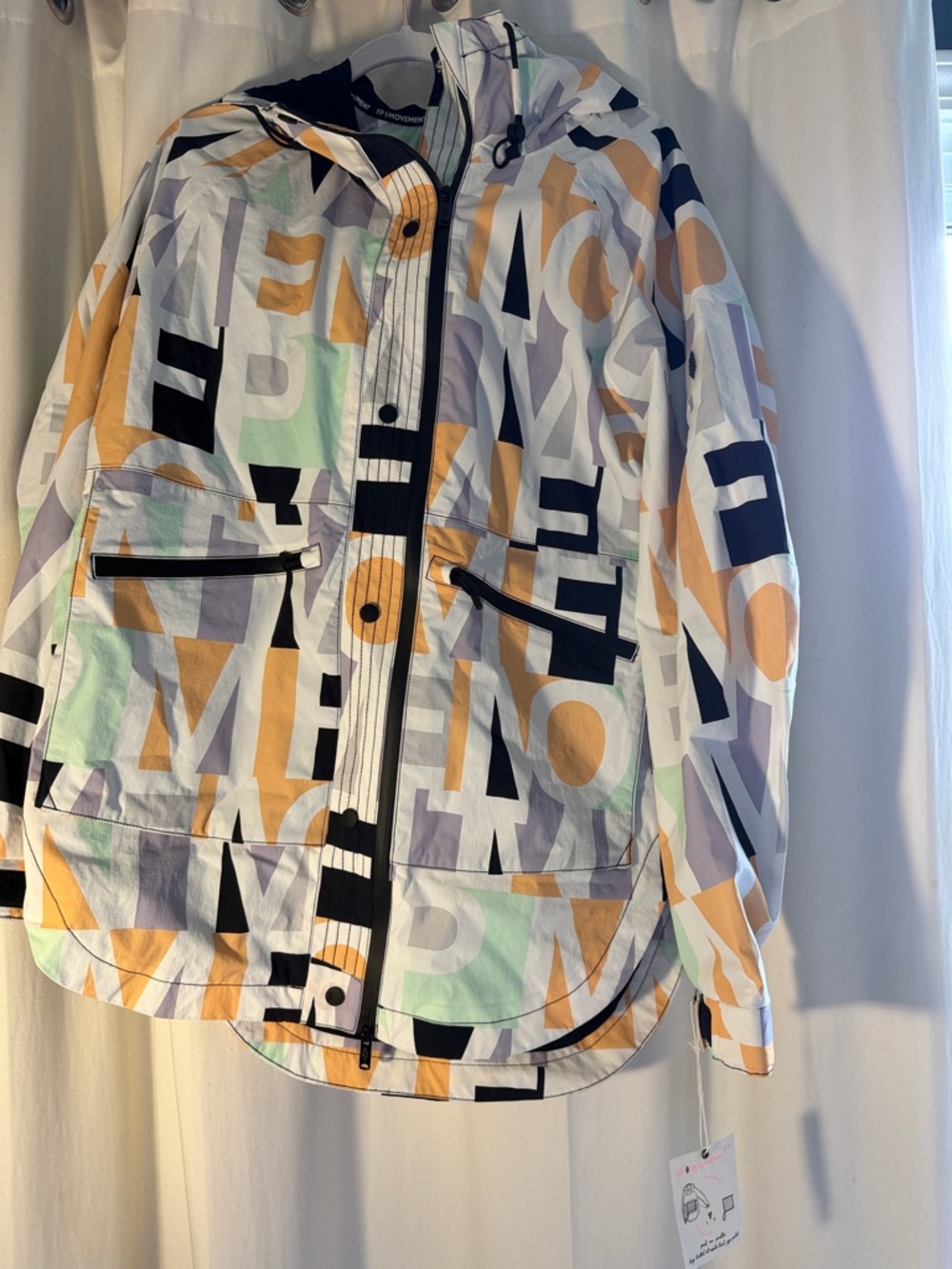 FREE PEOPLE MOVEMENT WITH TAG Hooded Rain Jacket in White, Orange, Purple & Mint